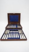 A 19th century mahogany cased part canteen of twelve John Gilbert dessert knives and forks. (one