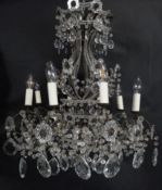 A vintage metal framed eight branch ceiling chandelier with cut crystal drops. Dia.65cm