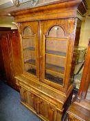 A VICTORIAN MAHOGANY GLAZED FLOORSTANDING BOOKCASE, the twin glazed door upper section with
