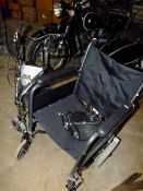 A WHEELCHAIR PLUS MOBILITY WALKER