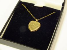 A 9CT BK & FT HEART SHAPED LOCKET