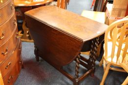 AN OAK BARLEYTWIST DROPLEAF TABLE