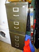 A PAIR OF TWO DRAWER METAL FILING CABINETS