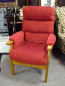 A MODERN RED UPHOLSTERED ARMCHAIR