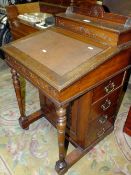 AN EDWARDIAN MAHOGANY CARVED DAVENPORT DESK W-55 CM