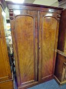 A 19TH CENTURY TWIN DOOR WARDROBE OF SMALL PROPORTIONS, the twin doors opening ti a hanging rail and