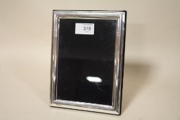 A HALLMARKED SILVER RECTANGULAR EASEL BACK PICTURE FRAME, OVERALL 20 X 15 CM