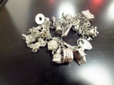 A STERLING SILVER CHARM BRACELET, APPROX TOTAL WEIGHT 71.8G
