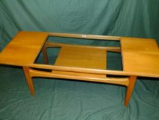 A RETRO G-PLAN TEAK AND GLASS TWO TIER COFFEE TABLE H-43 L-137 CM
