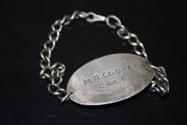 A WORLD WAR II SILVER ID BRACELET