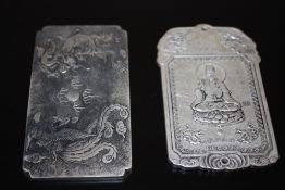 TWO ORIENTAL STYLE WHITE METAL PLAQUES/ TALISMANS