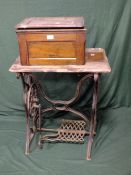 A VINTAGE TREADLE SINGER SEWING MACHINE - WOODWORK ALL DAMAGED