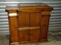 AN OAK SEWING MACHINE CABINET ( NO SEWING MACHINE )