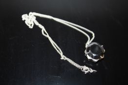 A MODERN STERLING SILVER AND BLACK DIAMOND STYLE PENDANT ON CHAIN