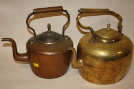 A VINTAGE BRASS KETTLE TOGETHER WITH A COPPER EXAMPLE