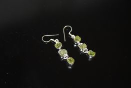 A PAIR OF STERLING SILVER AND PERIDOT EARRINGS