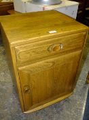 AN ERCOL WINDSOR SIDE CABINET H-69 W-46.5 CM