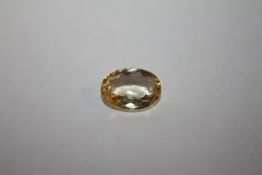 AN OVAL CUT 6.7 CT CITRINE STYLE STONE