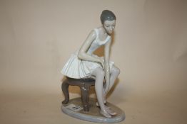A LARGE SEATED NAO BALLERINA FIGURE