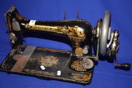 A VINTAGE SINGER SEWING MACHINE