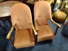 A PAIR OF VINTAGE OAK FRAMED UPHOLSTERED ARMCHAIRS