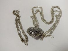 A PIERCED SILVER HEART LOCKET ON CHAIN TOGETHER WITH A BREAK, APPROX TOTAL WEIGHT 26.9G