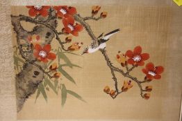 A FRAMED AND GLAZED ORIENTAL OIL ON SILK OF A BIRD ON A BRANCH