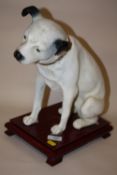 A REPRODUCTION RESIN HMV DOG FIGURE ON PLINTH