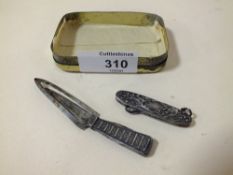 A HALLMARKED SILVER TROWEL SHAPED BOOK MARK TOGETHER WITH A FOLDING CHATELAINE BUTTON HOOK