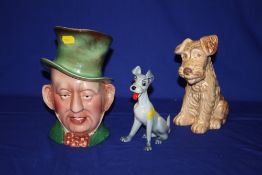 A SYLVAC DOG, A WADE LADY AND THE TRAMP FIGURE AND A MICAWBER CHARACTER JUG (3)