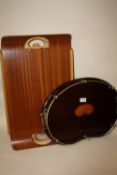 AN INLAID MAHOGANY TWIN HANDLED BEAN SHAPED SERVING TRAY TOGETHER WITH A FOLDING TABLE TRAY