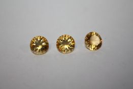 THREE ROUND CITRINE STYLE STONES