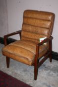 A RETRO STYLE TAN LEATHER ARMCHAIR