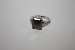 A STERLING SILVER AND BLACK DIAMOND STYLE DRESS RING