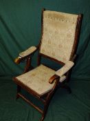 AN EARLY 20TH CENTURY MAHOGANY FOLDING ARMCHAIR