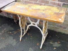 A SMALL TABLE WITH CAST METAL LEGS A/F