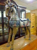 AN UNUSUAL CARVED AND PAINTED EASTERN WOODEN HORSE H-92 CM