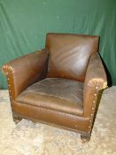 A PAIR OF VINTAGE CLUB STYLE LEATHERETTE ARMCHAIRS A/F (2)