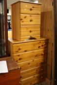 A HONEY PINE CHEST OF DRAWERS AND A BEDSIDE CHEST (2)