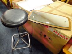 A VINTAGE TEAK WALL MIRROR AND A STOOL (2)