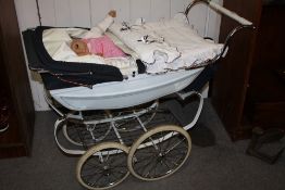 A SILVERCROSS DOLLS PRAM AND CONTENTS