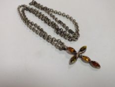 A STERLING SILVER AND AMBER CROSS PENDANT ON CHAIN, 24G