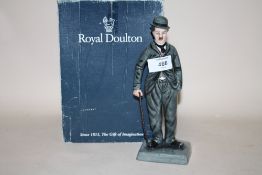 A ROYAL DOULTON LIMITED EDITION CHARLIE CHAPLIN FIGURE HN2771