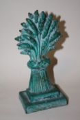 A VINTAGE DOORSTOP IN THE SHAPE OF A SHEAF OF CORN