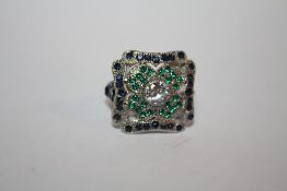 A LARGE SQUARE SHAPED BLUE AND GREEN DRESS RING - size O