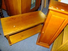 A SMALL OAK COFFEE TABLE AND A CD CABINET AND CONTENTS