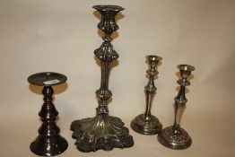 A PAIR OF SILVER PLATED CANDLESTICKS TOGETHER A LARGE EXAMPLE AND ANOTHER (4)