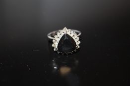 A STERLING SILVER AND MODERN BLACK DIAMOND STYLE DRESS RING