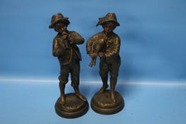 A PAIR OF ANTIQUE SPELTER FIGURES OF BOYS SIGNED 