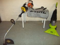 A PETROL LEAF BLOWER, AN ELECTRIC GARDEN VAC AND A PETROL SABRE STRIMMER (3)